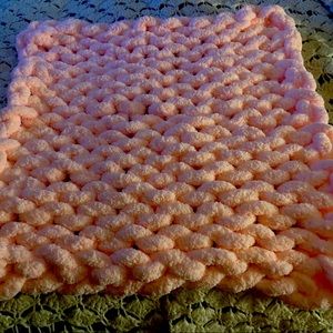 Chunky soft blankets all different colors and scarfs all different colors